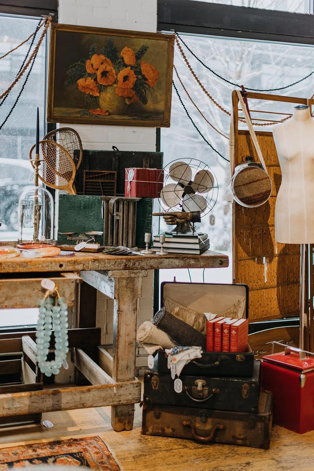 Vintage brass and leather objects arranged on a studio work table